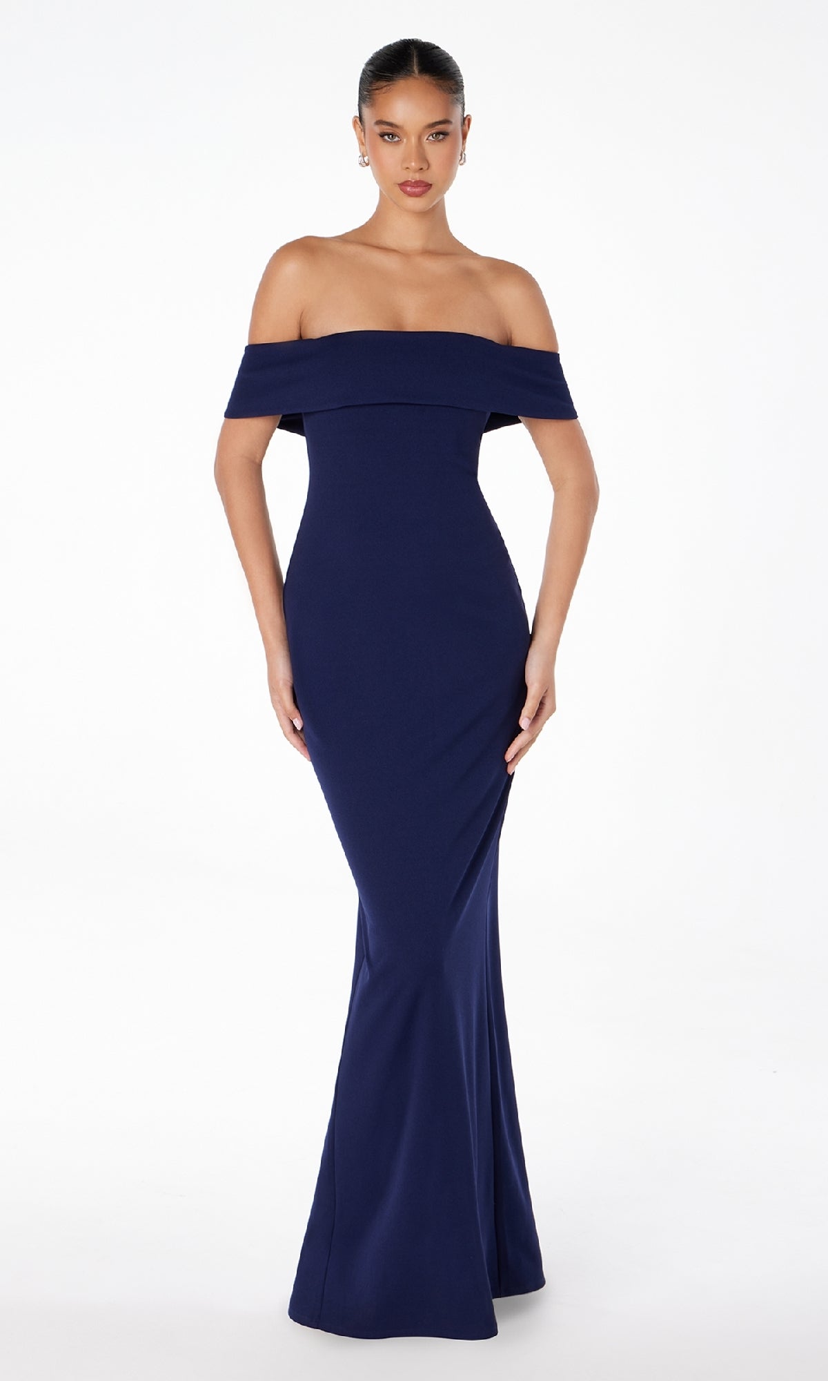 A woman models the Astee T2011 Off-the-Shoulder Long Prom Dress, a fitted, floor-length navy gown, standing against a plain white background.